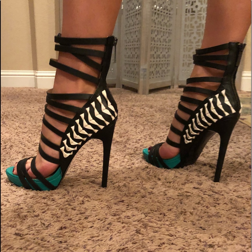 Never been worn strapped heels .